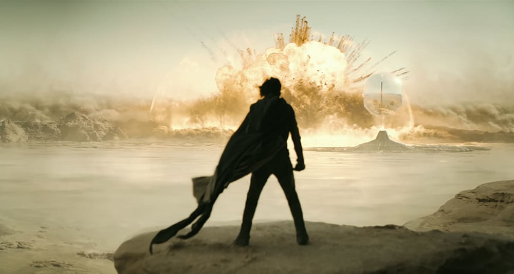 Paul Atreides watches a massive explosion in the distance, from Dune: Part Two