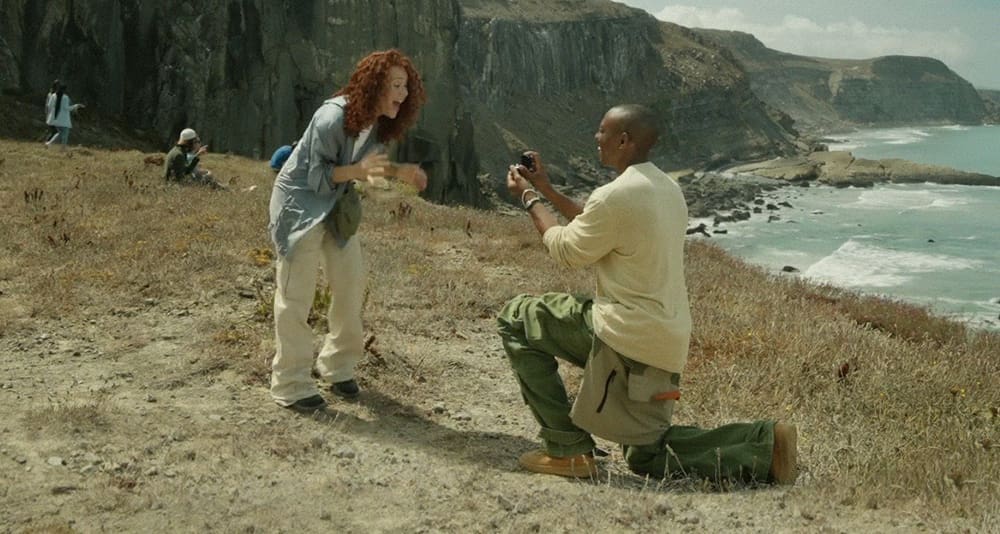 A man proposes to his girlfriend on a cliff and she screams in delight in an ad for the Google Pixel 8