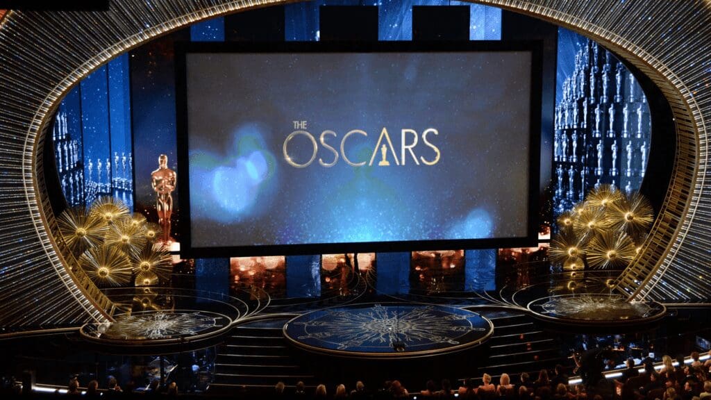 Oscars, In Memoriam, Academy Awards, tribute, departed talents, performers, filmmakers, artisans, emotional moment, Andrea Bocelli, Alexei Navalny, Tina Turner, Matthew Perry, Ryan O'Neal, Glenda Jackson, Norman Jewison, Anne Heche, Charlbi Dean, omissions, controversy, legacy, remembrance, celebration.